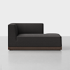 A modern black sectional sofa with a low backrest and short armrest on the left, featuring a wooden base, positioned on a light-colored floor against a plain white background.