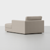 A modern, light beige sectional sofa with clean lines and a low backrest, positioned on a smooth, light gray floor against a plain white background. The chaise section extends to the left.