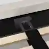 Close-up of a bed frame connection, showing a black metal support bracket attached to a wooden slat and the upholstered bed base. A black fabric strap is draped over the slat in the foreground.