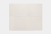 A square, off-white area rug with a subtle patchwork pattern created by slightly different textures in each section, placed on a plain white background.