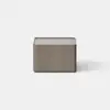 A modern, minimalist wooden nightstand with a single drawer partially open, placed on a light gray floor against a plain white background.