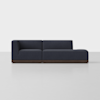 A modern dark blue sectional sofa with a left armrest and chaise lounge on the right, set on a low wooden base against a plain light gray background.