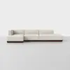 A modern, modular sectional sofa with cream-colored upholstery and a dark wooden base, displayed against a plain white background.