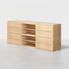 A modern wooden dresser with twelve drawers and three open central shelves, set against a plain white background. The dresser has a light wood finish and a minimalist design.
