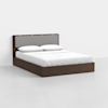 A modern platform bed with a dark wood frame and a gray upholstered headboard, neatly made with white bedding and two pillows, set against a plain white background.