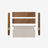 Five components of a disassembled bed frame are laid out on a white background, including two wooden side rails, two wooden support panels, and a beige upholstered headboard.