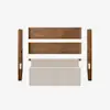 Five components of a disassembled bed frame are laid out on a white background, including two wooden side rails, two wooden support panels, and a beige upholstered headboard.