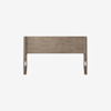 A wooden headboard with a light brown finish, featuring a simple, rectangular design and horizontal paneling, photographed against a plain white background.