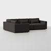 A dark gray, modern L-shaped sectional sofa with clean lines and plush cushions, set against a plain white background.