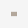 A small, rectangular, beige object with a smooth, flat surface is centered on a plain white background.
