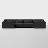 A modern, modular dark gray sectional sofa with clean lines and low-profile cushions is arranged in a straight configuration against a plain, white background.