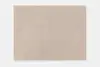 A rectangular beige area rug with a soft, solid color and subtle texture, photographed against a white background.