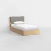 A single wooden bed with a grey upholstered headboard, white bedding, and a pillow, placed in a minimal, white-walled room with a light-colored floor.