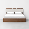 A modern wooden bed with a rectangular upholstered headboard, white bedding, and two white pillows, set against a plain white wall and gray floor.