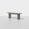A minimalist wooden bench with a light gray cushioned seat and two wide rectangular legs, set against a plain white background.