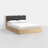 A modern wooden bed with a light wood frame, white bedding, two pillows, and a padded dark gray headboard against a plain white background.