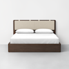 A modern bed with a dark wooden frame and beige upholstered headboard, neatly made with white bedding and two white pillows, set against a plain white wall and light gray floor.