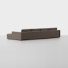A modern L-shaped sectional sofa with a low back and armrests, upholstered in brown fabric, positioned on a seamless white background.