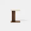 A modern side table with a rectangular wooden base, a vertical wooden support, and a light-colored rectangular top, displayed against a plain white background.