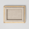 A rectangular empty beige canvas with a wooden frame, viewed from above against a light gray background.