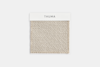 A square fabric swatch in a light beige color with a label reading THUMA at the top, displayed against a plain white background. The fabric has a textured, woven appearance.