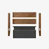 Disassembled bed frame with two wooden side rails, two wooden end panels, and a gray upholstered headboard laid out on a white background.