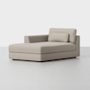 A modern light beige chaise lounge with a single armrest on the left, a rectangular back cushion, and a matching bolster pillow, placed on a plain light gray floor against a white background.