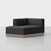 A modern, dark gray upholstered corner chair with clean lines and a low wood base, placed on a smooth, light-colored floor against a plain white background.