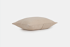 A rectangular beige pillow with a subtle textured pattern, shown against a plain white background.