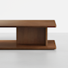 Rectangular wooden coffee table with clean lines and a minimalist design, featuring a solid central support and smooth surfaces, set against a plain white background.