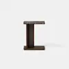 A modern side table with a rectangular dark marble top and a dark wooden base, shaped like an offset T, against a plain white background.