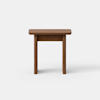 A small wooden table with a rectangular top and four straight legs, shown against a plain white background.