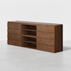 A modern wooden sideboard with a smooth finish, featuring three central open shelves and three drawers on each side, set against a plain white background.