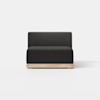 A modern armless sofa chair with dark gray upholstery and a light wooden base, shown against a plain white background.