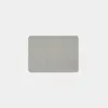 A rectangular, light grey felt pad with rounded corners is centered on a plain white background.