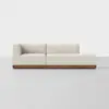 A modern cream-colored sectional sofa with a low wooden base, placed against a plain white background.