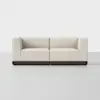A modern, two-seat sofa with light beige upholstery and a dark wooden base, set against a plain white background.