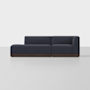 A modern, dark blue sectional sofa with low backrests and armrests, set on a wooden base, placed in a minimalistic, light-colored room.