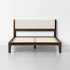 A modern wooden bed frame with a light beige upholstered headboard, wooden slats for mattress support, and a dark brown finish, positioned against a plain white wall on a light gray floor.