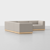 A modern beige sectional sofa with clean lines and a low wooden base, arranged in an L-shape on a plain, light-colored floor against a white background.