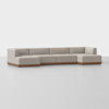 A modern, L-shaped sectional sofa with light beige upholstery and a wooden base, set against a plain white background.