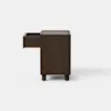 A minimalist, dark wood cabinet with clean lines and short legs, set against a plain white background.