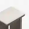 A close-up view of a modern wooden stool with a light-colored, cushioned seat against a plain white background.