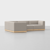 A modern L-shaped sectional sofa with light gray upholstery and a wooden base, set on a smooth, light-colored floor against a plain white background.