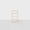 A simple, four-tier wooden bookshelf stands on a light gray floor against a plain white background. The shelf is empty and centered in the image.