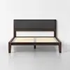 A modern wooden bed frame with a dark finish, featuring a charcoal gray upholstered headboard and wooden slats, is set against a plain white wall and light gray floor.
