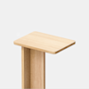 A minimalist wooden side table with a rectangular top and a simple, clean-lined vertical base, set against a plain white background.