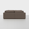 A modern, modular brown sectional sofa viewed from the back against a plain white background. The sofa has clean lines and plush cushions, with no visible legs.