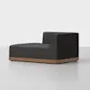 A modern, dark gray chaise lounge with a low wooden base and a right armrest, set against a plain light background.