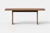 A simple wooden table with a rectangular top and two legs, shown against a plain white background.